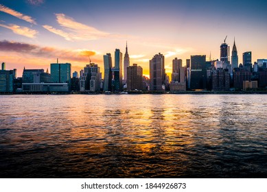 Beautiful sunset and New York city skyline of Manhattan