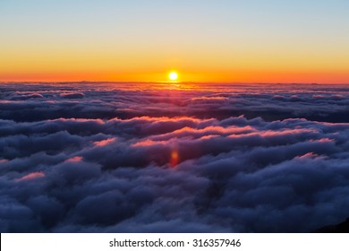 Beautiful Sunset On The Hill Above Clouds