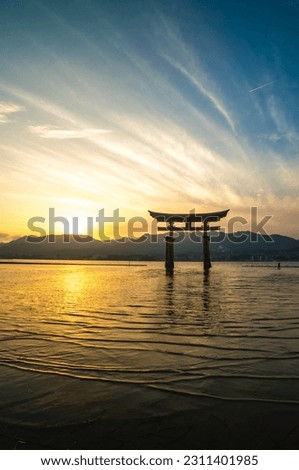 Beautiful sunset and Otorii gate of Itsukushima shrine in Miyajima in summer in Hiroshima, Japan