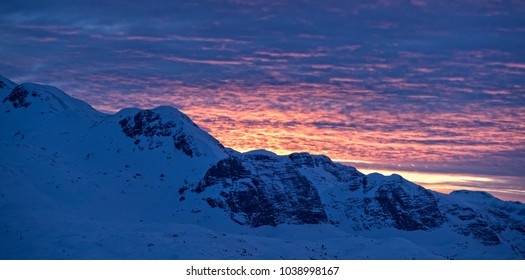 Beautiful sunset over Alpine mountains. Outdoor winter scenery