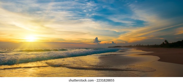 Beautiful sunset over the beach by the tropical sea. Wide photo. - Shutterstock ID 2231828855