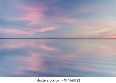beautiful sunset over calm cold lake
