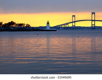 Beautiful sunset over Claiborne Pell Bridge and lighthouse in Newport, Rhode Island