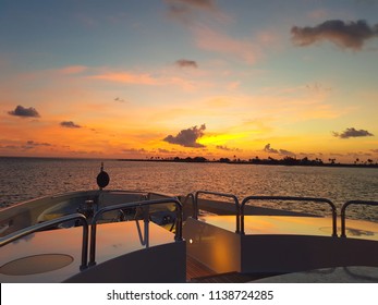 Beautiful sunset over Harbour Island from the bow of a luxury mega Yacht in Bahamas