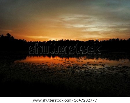 Similar – Morgensonne scheint auf den Dunst über einem See