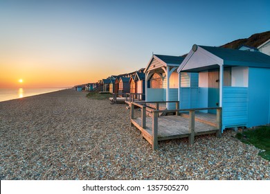 Beautiful Sunset Over A Row Of Colourful Beach Huts At Milford On Sea On The Hampshire Coast