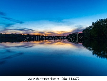 Similar – Image, Stock Photo Tranquil sunset over smooth water