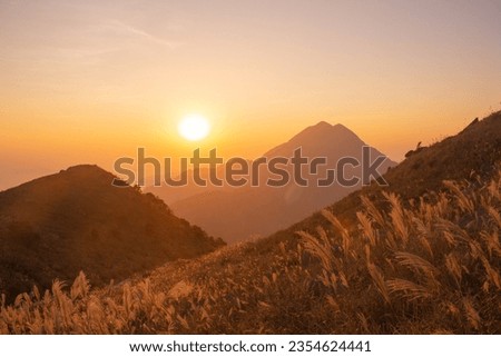 Beautiful sunset at Sunset Peak in Autumn, Lantau Island, Hong Kong. Copy space