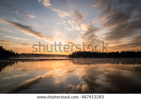 Beautiful sunset reflected in the lake. 