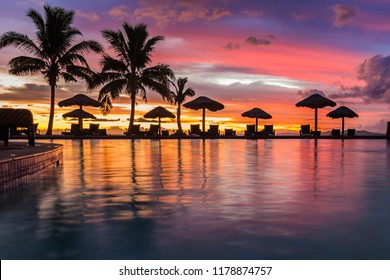 A Beautiful Sunset Reflecting In The Water In Fiji