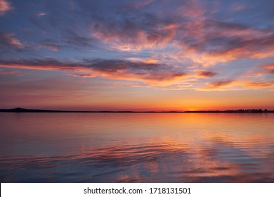 Beautiful sunset with reflection on the lake - Powered by Shutterstock