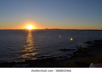 Beautiful sunset with the reflection of the sun's rays in the ocean