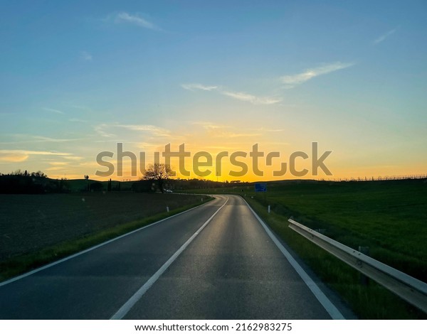 Beautiful sunset in\
road trip in Tuscany,\
Italy