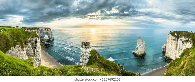 Beautiful sunset sea beach coast view in Etretat France Normandy. Atlantic landscape ocean cliffs and rocks. - Shutterstock ID 2257692103