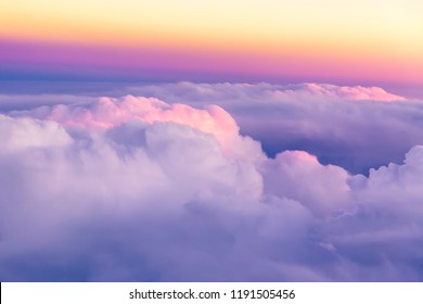 Beautiful Sunset Sky Above Clouds With Nice Dramatic Light. View From Airplane Window