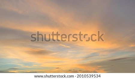 Beautiful sunset sky background with clouds