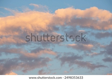 Beautiful sunset sky background with clouds. Scenic cloudscape.