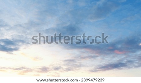 Beautiful sunset sky. Panorama with Cirrus clouds. Panorama of the blue-pink sunset sky - the gentle sky on the horizon. Natural sky, amazing and cinematic sunset texture background