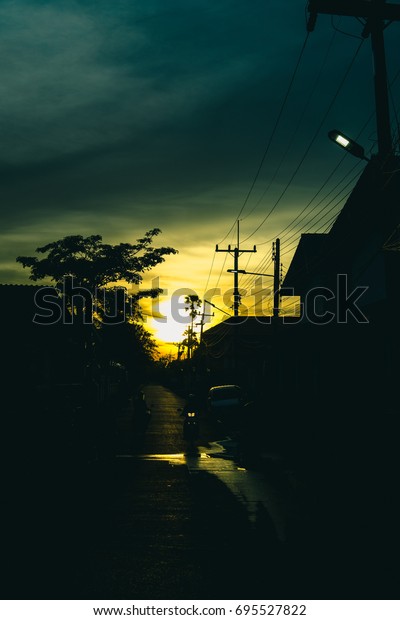 The
beautiful sunset with a street behind the
shadow.