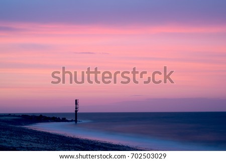 A beautiful sunset in the summer while on holiday at the beach, Caister On Sea, Great Yarmouth, Norfolk, England