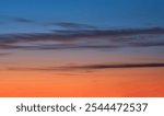 Beautiful sunset and sunrise. Dark moody blue and orange sunset sky. Natural background. Simple background sky for poster or mock up. Soft focus.