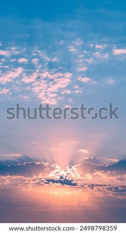 Beautiful sunset or sunrise, sky with clouds, sun rays breaking through the clouds, magical, fabulous natural background, serenity and calm
