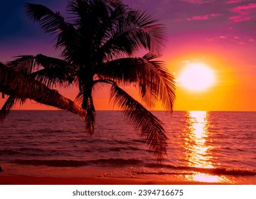 Beautiful sunset tropical beach with palm tree and pink sky for travel and vacation in holiday relax time - Powered by Shutterstock