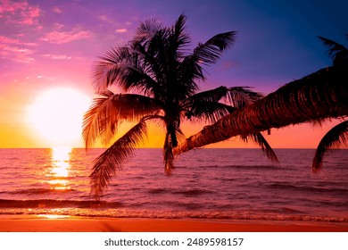 Beautiful sunset tropical beach with palm tree and pink sky for travel and vacation in holiday relax time - Powered by Shutterstock