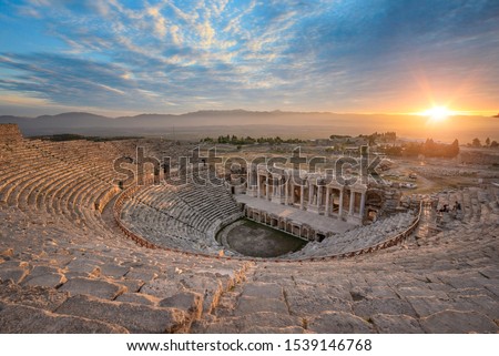 Beautiful sunset view of the Ancient theater of the Roman city of Hierapolis in Pamukkale, Turkey. The site is a UNESCO World Heritage site
near the city of Denizli. 