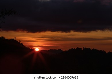 Beautiful Sunset View.  Disappearance Of The Sun Below The Horizon Due To Earth's Rotation.