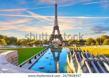 Beautiful sunset view of Eiffel Tower and Trocadero Gardens Fountain, Paris, France