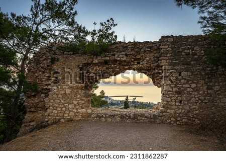 Beautiful sunset view from the historical castle of Kyparissia coastal town at sunset. Located in northwestern Messenia, Peloponnese, Greece, Europe.