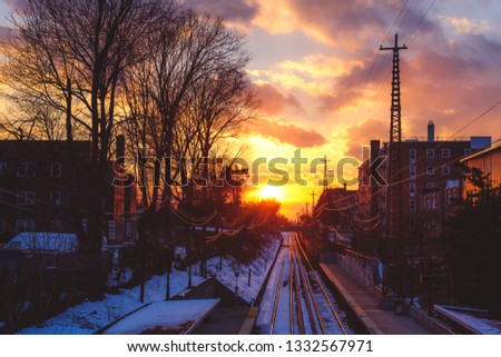 Beautiful sunset viewed from train station platform in Bayside, Queens in winter