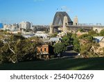 The beautiful Sydney Harbour Bridge and North Sydney beyond viewed from the grassy knoll of Observatory Hill.