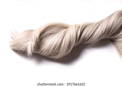 A Beautiful Syntetic Platinum Blond Thick Wavy Curly Blond Hair, Isolated On The White Background