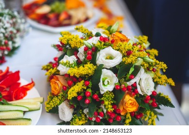 Beautiful Table Decoration In Orange Autumn Fall Colours, Table Arrangement On Event In A Restaurant With Flowers, Bouquet, Berries, Fruits And Leaves On A Wedding Reception Banquet Party