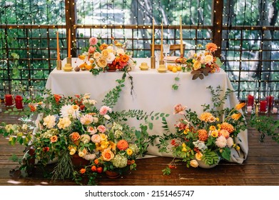 Beautiful Table Setting With Autumn Flowers, Orange Napkins And Candles. Autumn Wedding Concept. 