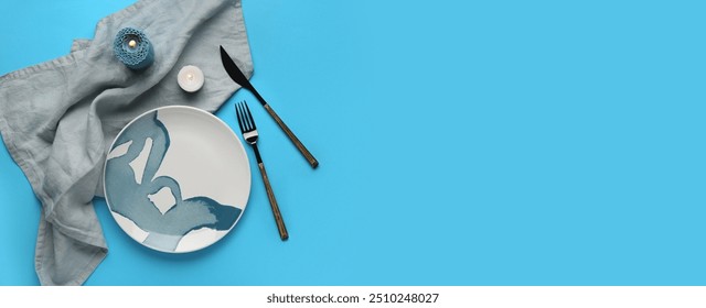 Beautiful table setting with candles on light blue background with space for text - Powered by Shutterstock