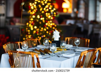 Beautiful Table Setting For Christmas Party Or New Year Celebration In Restaurant
