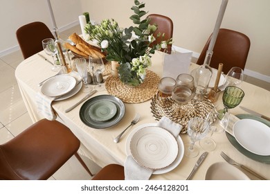 Beautiful table setting with eustoma flowers for wedding celebration in room