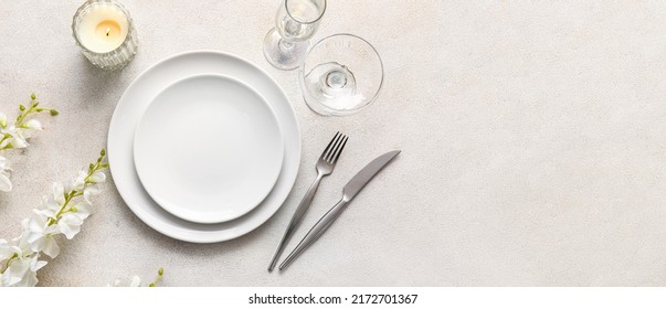 Beautiful table setting with floral decor on light background with space for text, top view - Shutterstock ID 2172701367