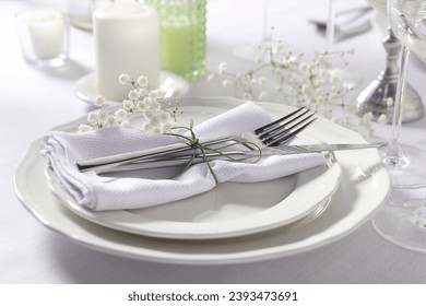 Beautiful table setting with floral decor, closeup - Powered by Shutterstock