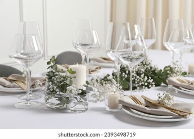 Beautiful table setting with floral decor indoors - Powered by Shutterstock