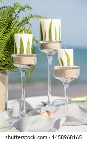 Beautiful table setting on the beach for romantic dinner for two. Wedding concept. Honey moon dinner.