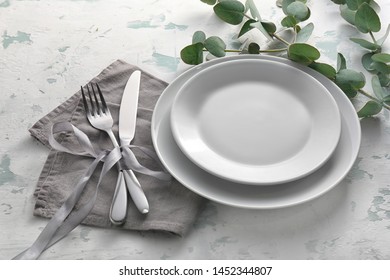 Beautiful table setting on light background