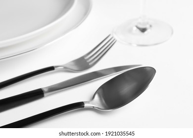 Beautiful table setting on white background, closeup