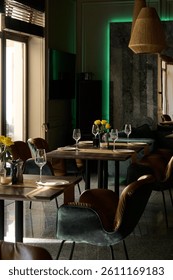                   Beautiful table setting in a restaurant with rays of sunshine             