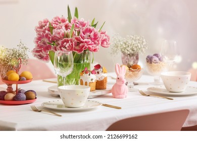 Beautiful table setting with spring flowers for Easter celebration - Shutterstock ID 2126699162