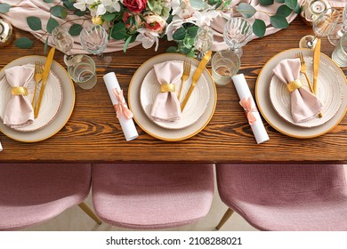 Beautiful table setting with wedding invitations, top view
