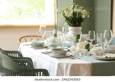 Beautiful table setting with white flowers for wedding celebration in room - Powered by Shutterstock